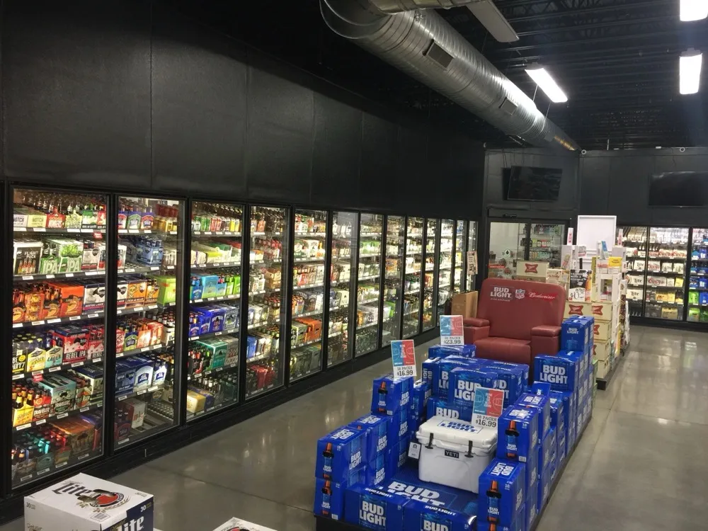 Beer cave and cooler wall stocked with craft and domestic beer at Regal Marketplace