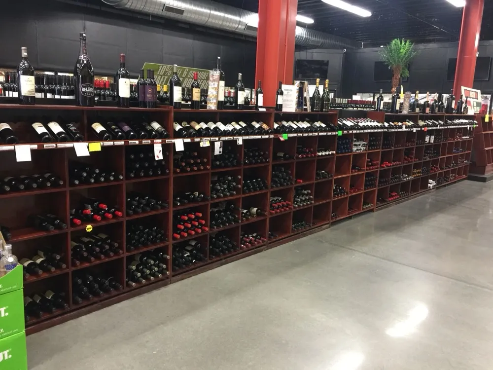Rows of fine wine bottles on wooden shelving at Regal Marketplace